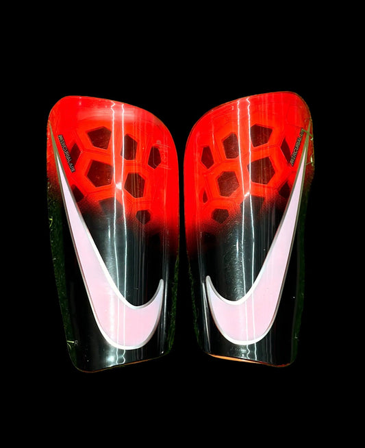 Canilleras gama alta NIKE