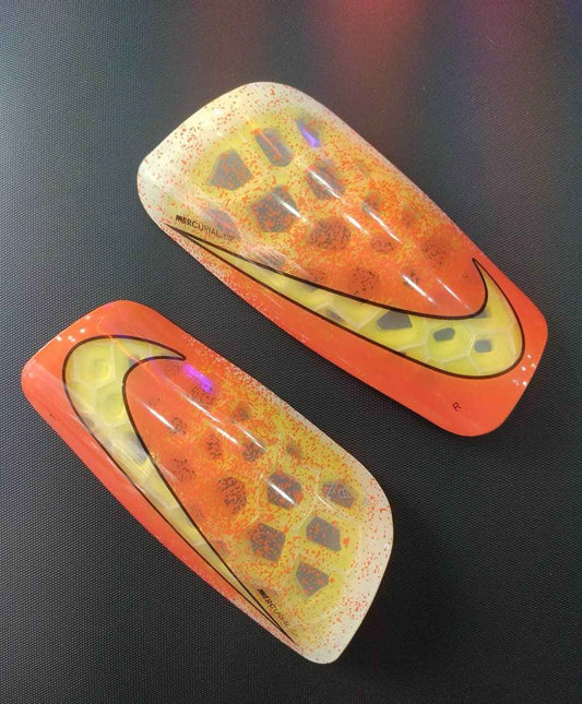 Canilleras gama alta NIKE